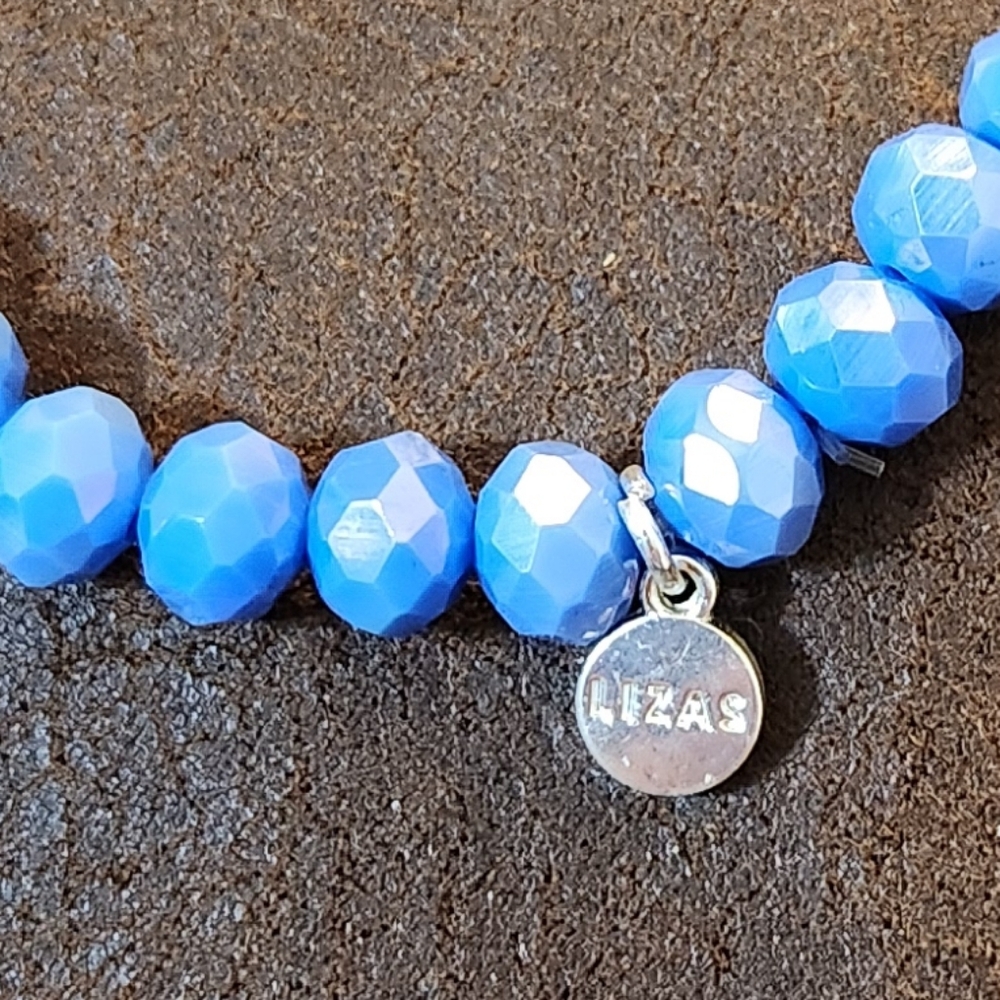 Blue Beaded Bracelet And Looks Like Purple. 8"